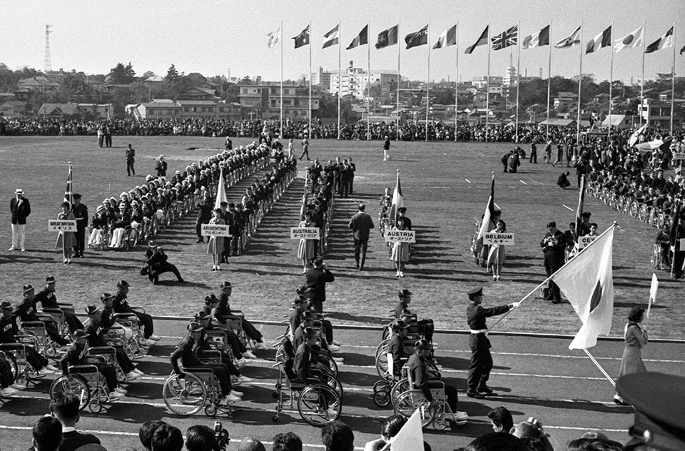 The Opening Ceremony of the 1964 Tokyo Paralympic Games in which para athletes from 21 countries participated. The Japanese team proceeded into the stadium by wheelchair.
