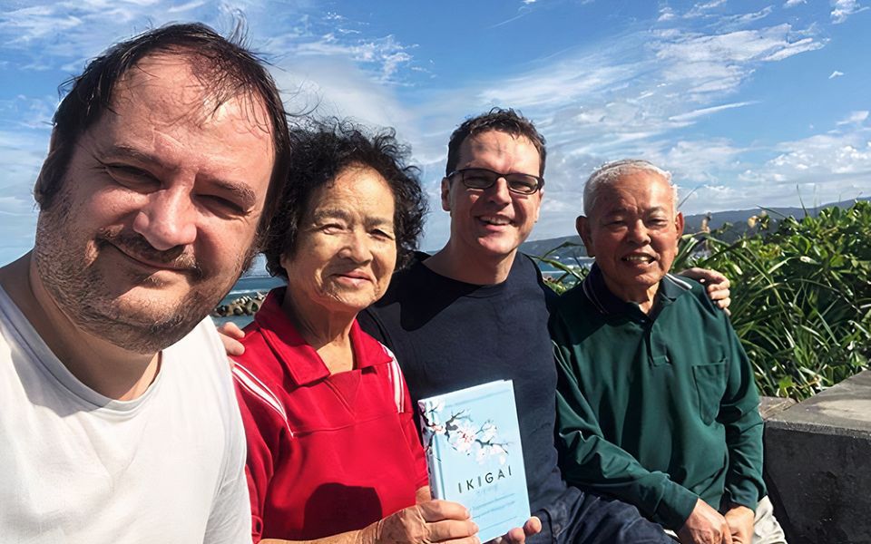Héctor Garcia (second from right) and Francesco Miralles (far left), authors of Ikigai: The Japanese Secret to a Long and Happy Life, say that they realized how important and powerful ikigai was while interacting with the senior citizens of Olimi Village, Okinawa Prefecture.