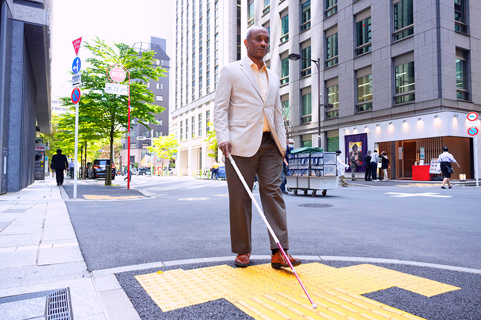 Mohamed Omer Abdin notes that Japanese cities have extensive mass-transit systems and tactile paving is widespread. Furthermore, orientation and mobility training, including walking with a white cane, is widely available. The existence of appropriate facilities and assistance for the visually impaired in Japan was life-changing for him after leaving Sudan.