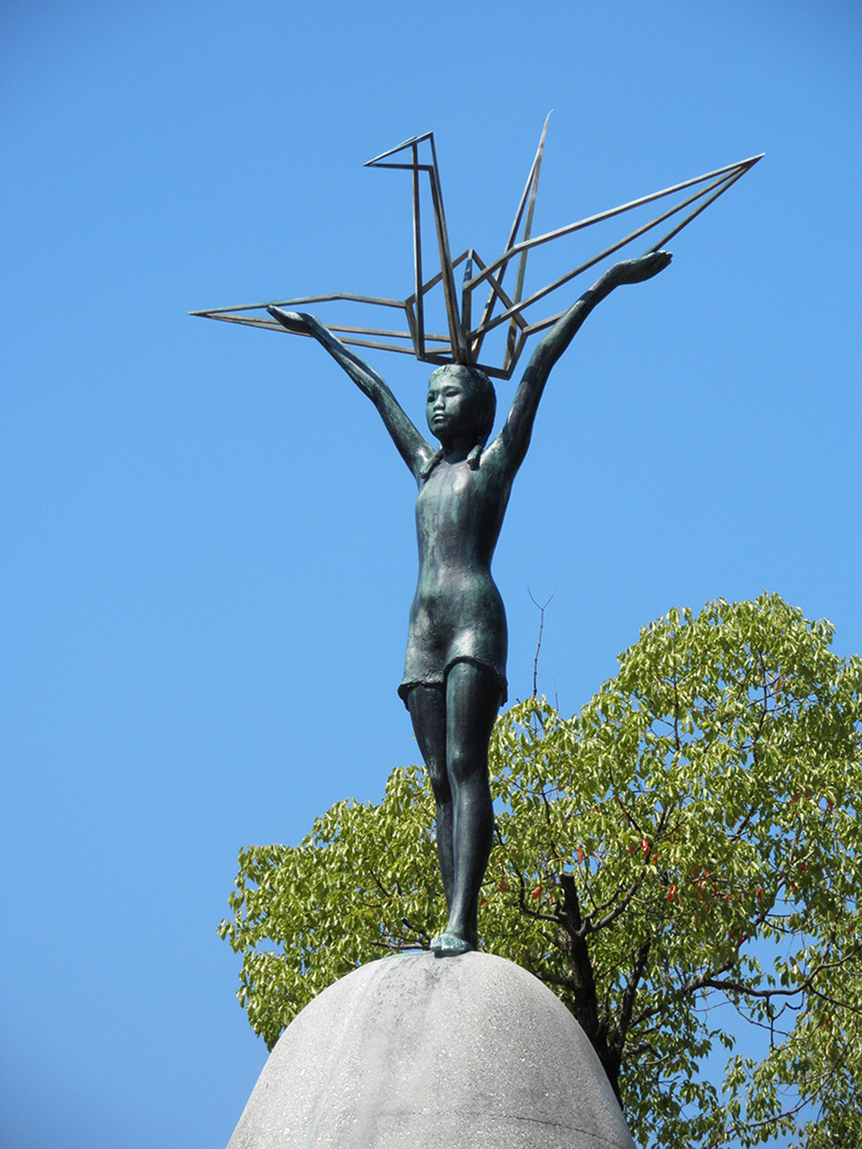 The Children’s Peace Monument in the Hiroshima Peace Memorial Park depicts a young girl modeled after Sadako holding a crane up to the sky in her outstretched arms. SPOTTY/PHOTO LIBRARY