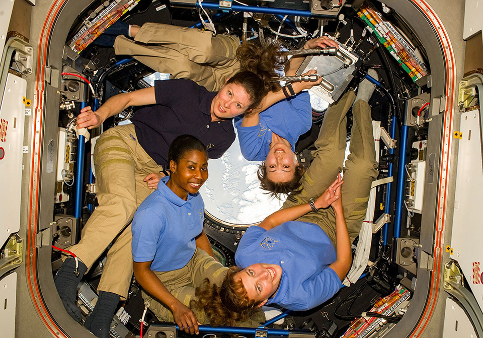 A picture of four astronauts including Yamazaki Naoko (top right) inside the International Space Station. NASA