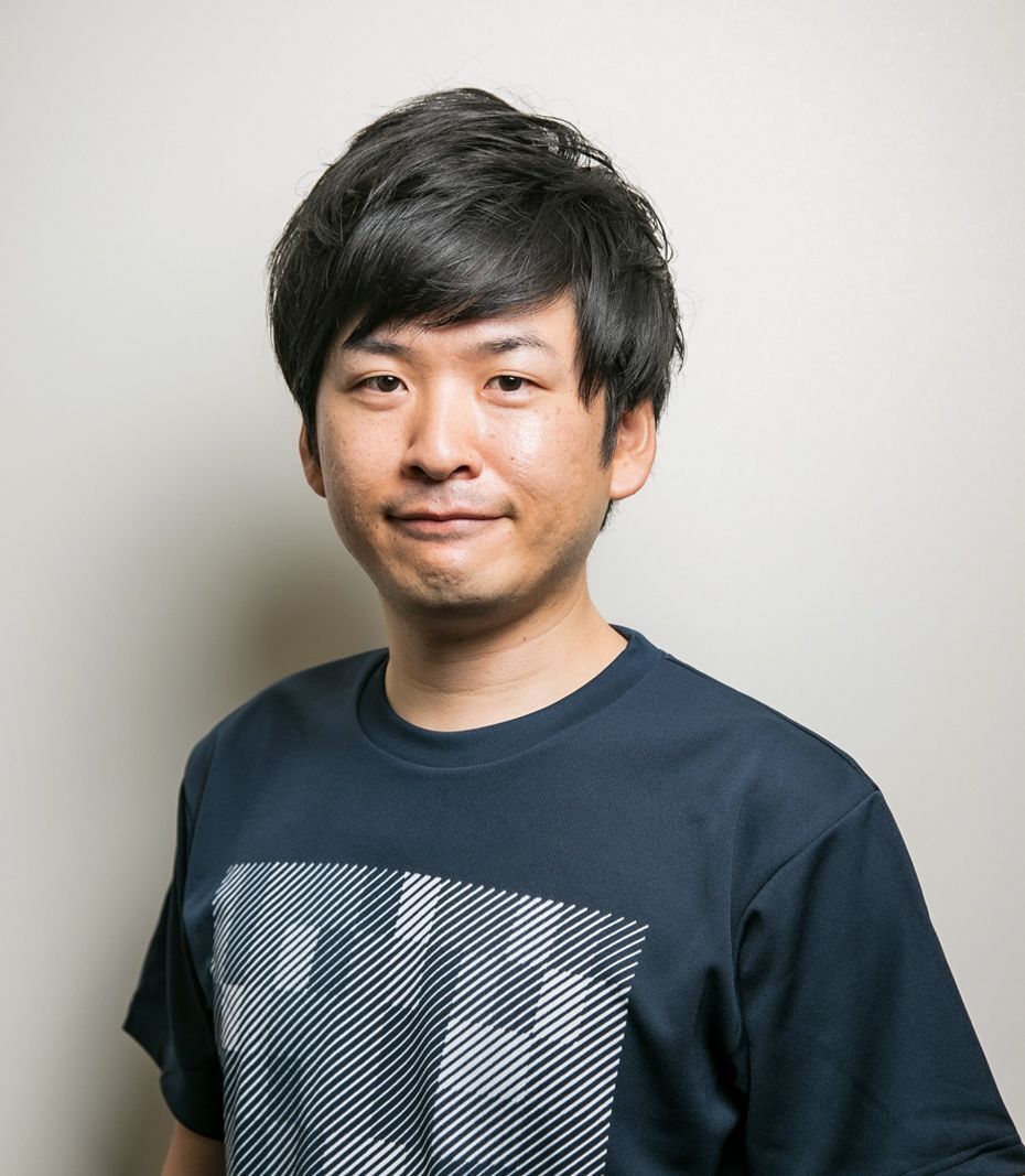 Kazuki Sakamoto, from Sagri Co., Ltd., wearing a black t-shirt with a gray pixelated design against a plain white background.