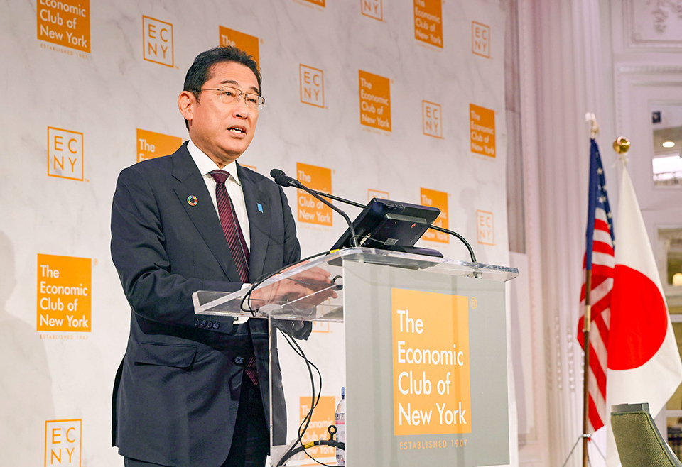 Prime Minister Kishida standing at a clear podium, giving a speech at the Economic Club of New York in September 2023.