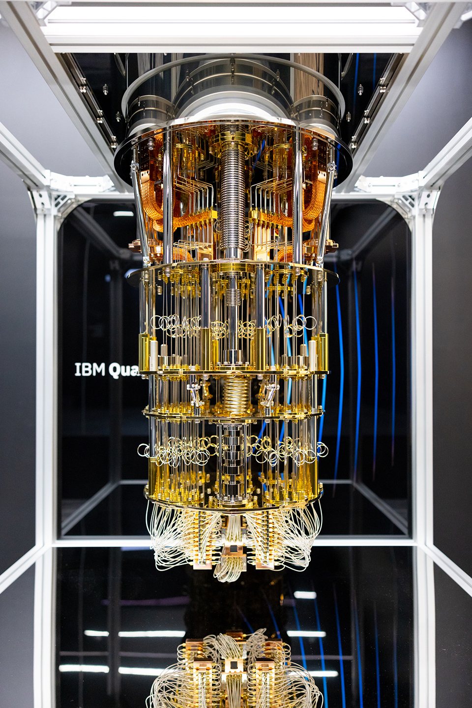 A quantum computer showing a complex design with multiple layers of gold cylindrical plates and connectors.