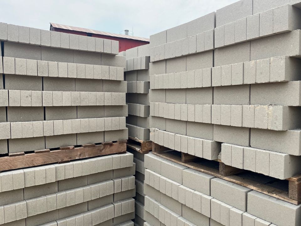 Stacks of gray non-fired bricks