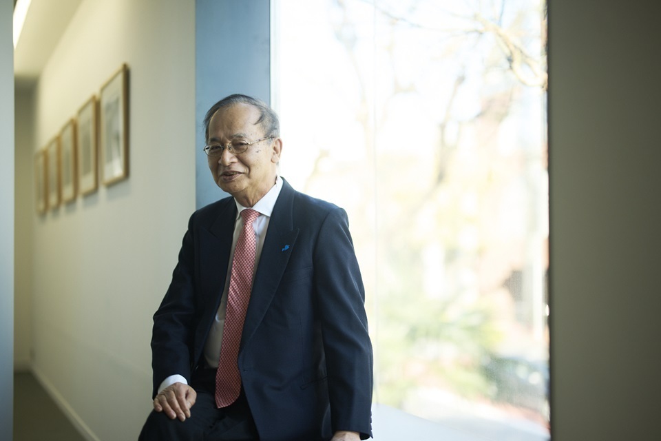 Kitagawa Fram, the general director of the Setouchi Triennale, posing in front of a bright window
