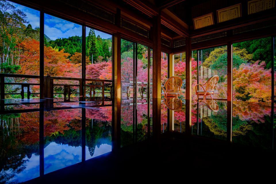 Autumn foliage reflecting on dark laquered tables at Kankyo Geijutsu no Mori in Saga Prefecture