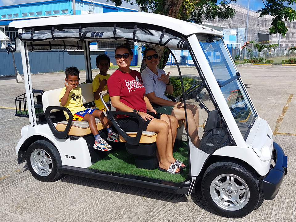 Tourists on board an electric golf cart in Palau