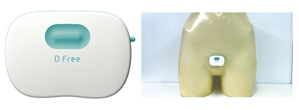 Image of a white and light blue DFree device.  The Dfree device shown positioned on the lower abdomen region of a mannequin.