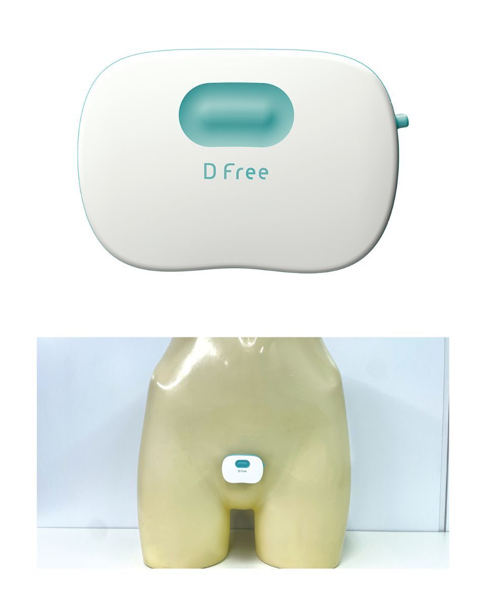 Image of a white and light blue DFree device.  The Dfree device shown positioned on the lower abdomen region of a mannequin.