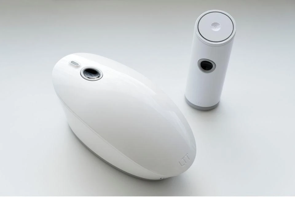 Two prototypes of non-invasive blood glucose sensors, with friendly rounded designs. 