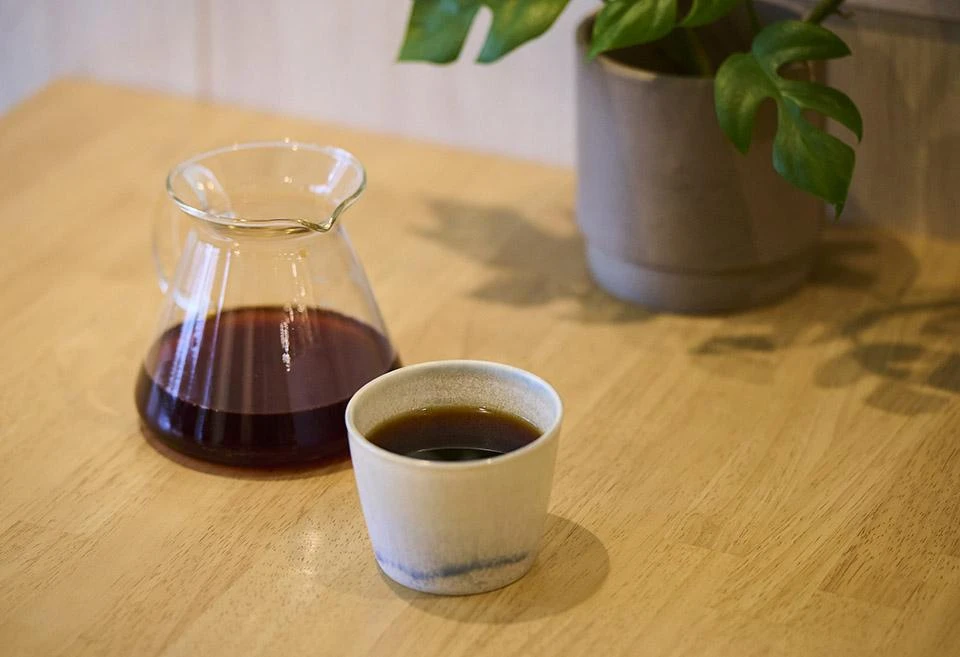 A cup and beaker filled with Atarao's 