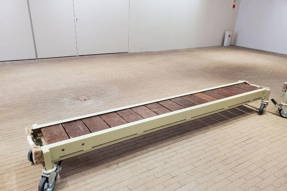 A bench where the seat surface is made from a material created from cacao husks, used at Expo 2025 Osaka, Kansai, Japan.