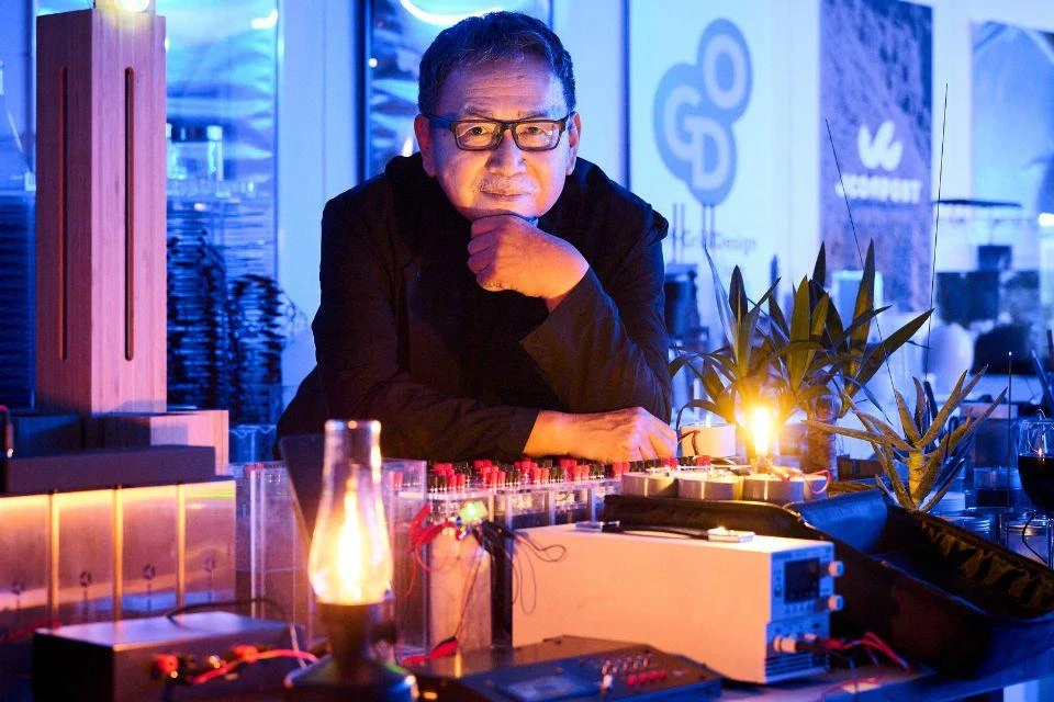 Nakagawa Satoshi, CEO of tripod design Co., Ltd, shown surrounded by his power collection technology