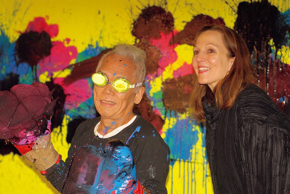 Alexandra Munroe and Ushio Shinohara in front of the Boxing Painting, The Poppy Field, 2009 Photo by Noriko Shinohara