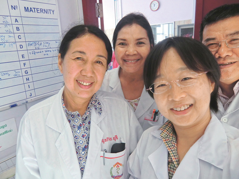 Dr. IWAMOTO Azusa (front row, right) with Cambodian doctors of the Neonatal Care Unit at the NMCHC.