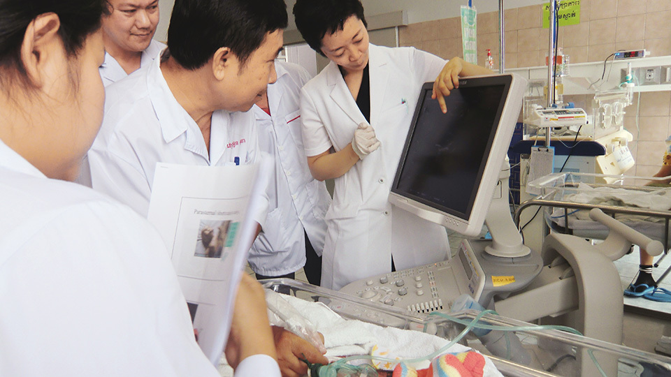 Doctors learn how to use ultrasound to check the baby’s heart in the Neonatal Care Unit at the NMCHC. Midwives, doctors, and students from across the country have been trained there.